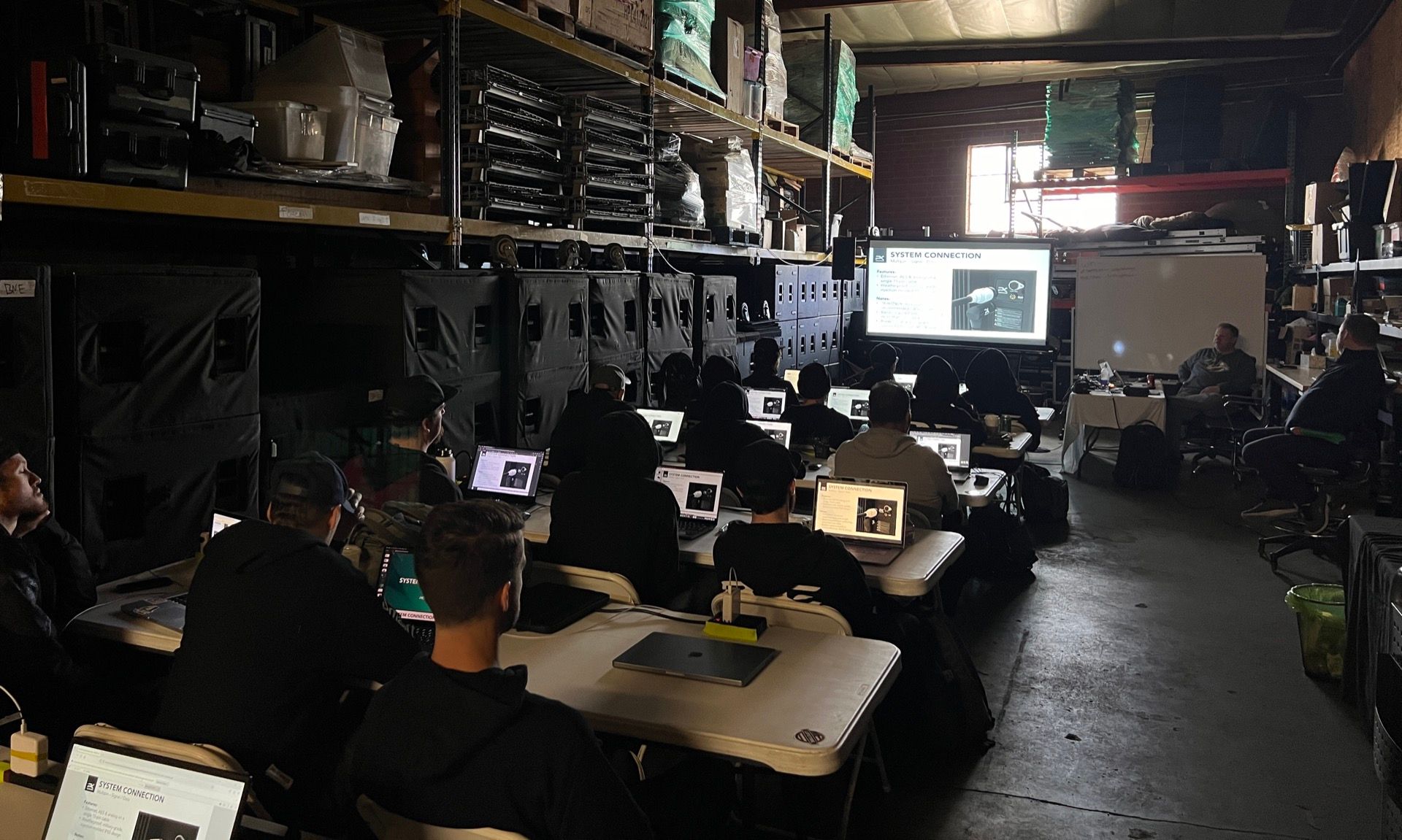 Engineers deploying a PK Sound robotic line array during training